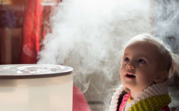 baby girl mystifiied by a humidifier picture id177711889 1