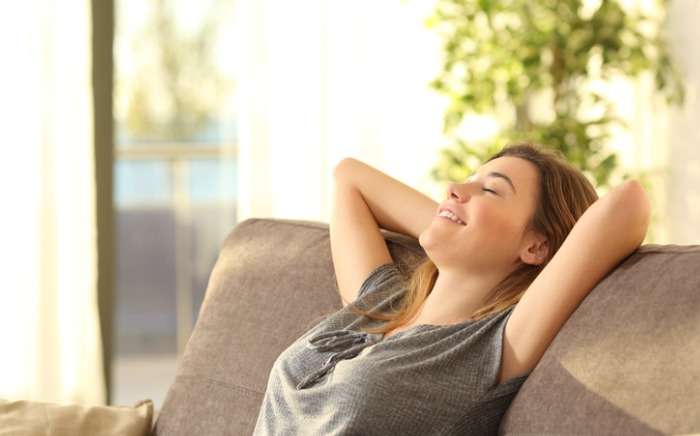 girl relaxing on a sofa at home picture id646457570 1