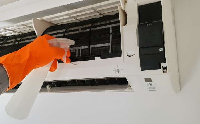 modern airconditioner unit service cleaning the filter to prevent picture id1186472257 1