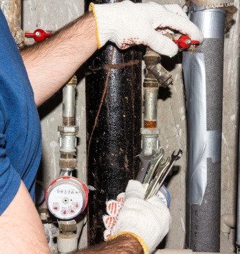 plumber repairs the pipes a man from the service and maintenance of picture id1011082328