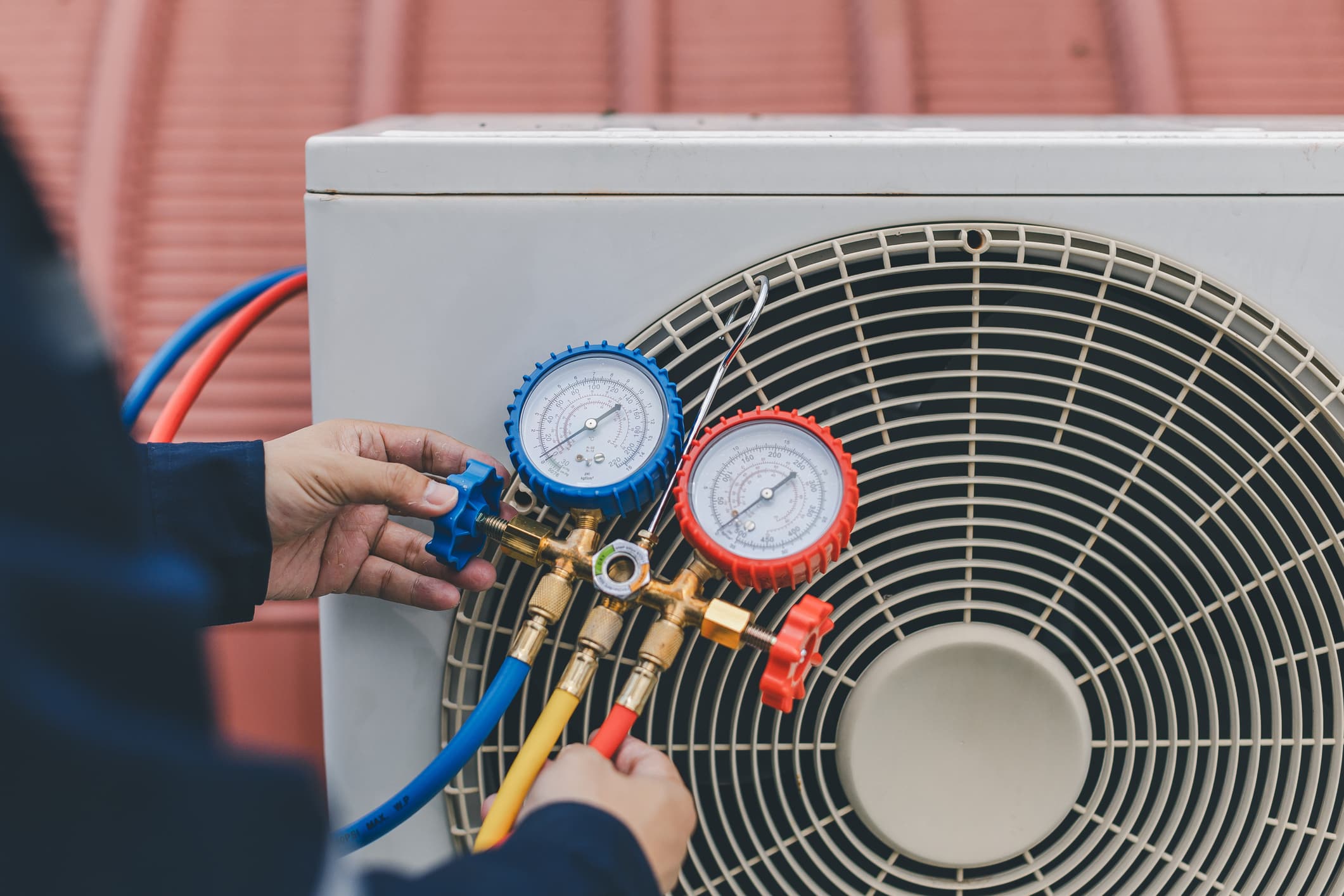 Technician is checking air conditioner.